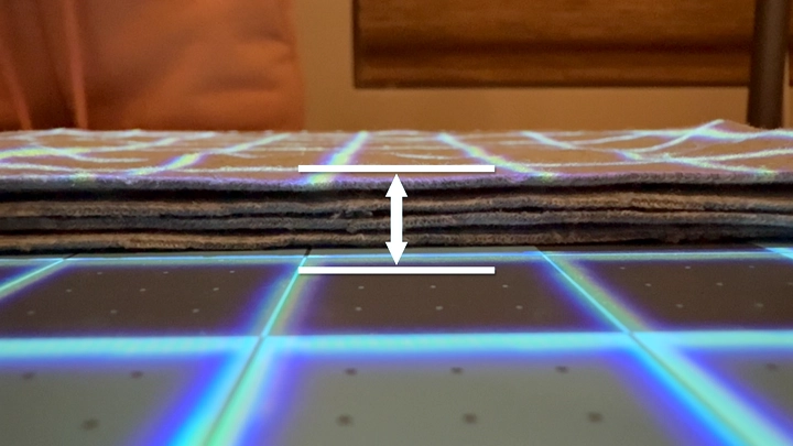 Fabric thickness adjustment in IntelliSew