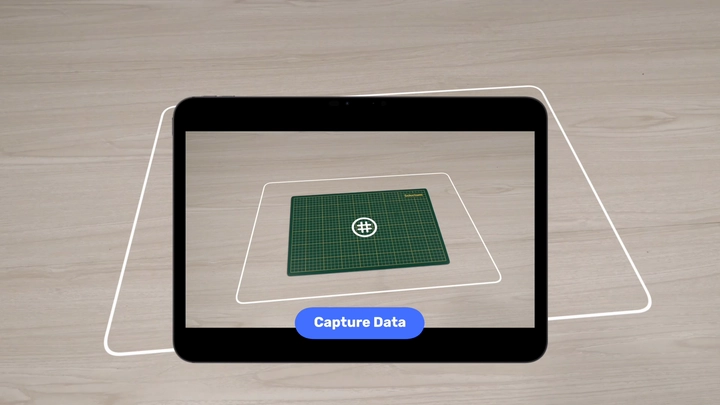 A cutting mat framed in a device camera for AI calibration